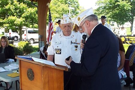 Cdr White receive past commander ring.jpg