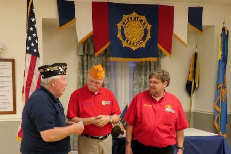 Post 124 Post Commander Ted Gage making donation to OCW.jpg