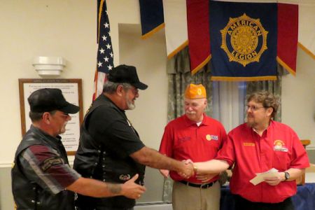 Riders President Isidro _Sid_ making check presentation for OCW.jpg