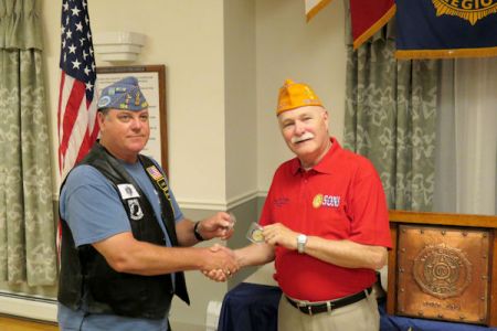 Todd Gannon and Doc Gibbs exchange coins.jpg